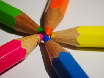 Close-up of colored pencils on table