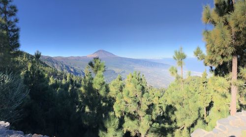 Scenic view of mountains against clear blue sky