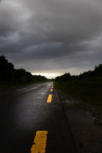 Highway against dramatic sky during sunset