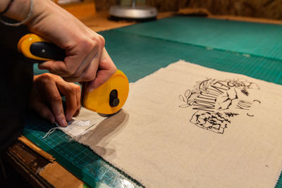 High angle view of person working on paper