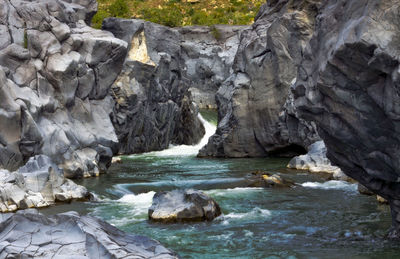 View of river amidst rock formations