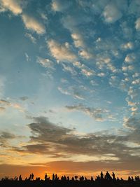 Low angle view of silhouette landscape against sky during sunset