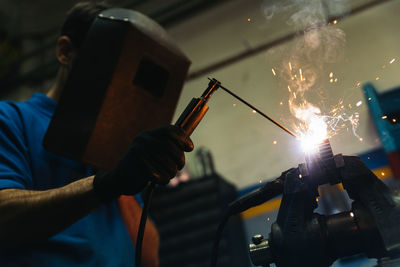 Man working on machinery in factory