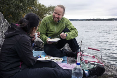 Couple having picnic at lake