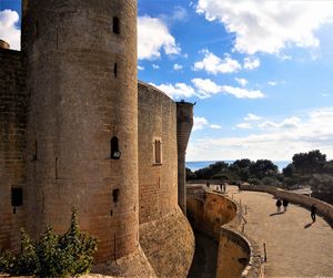 View of castle against cloudy sky