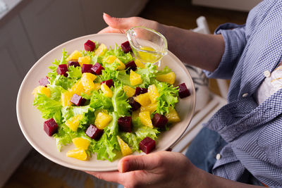 Caesar salad with copyspace on a wooden table on kitchen