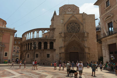 Group of people in front of historical building