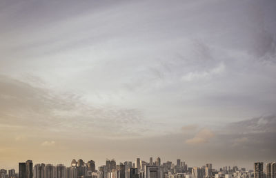 Modern buildings in city against sky