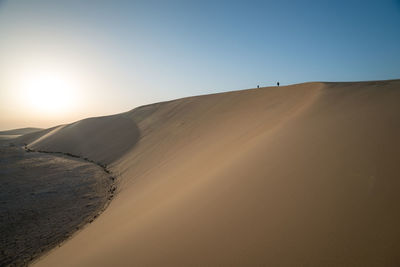 Scenic view of desert against clear sky