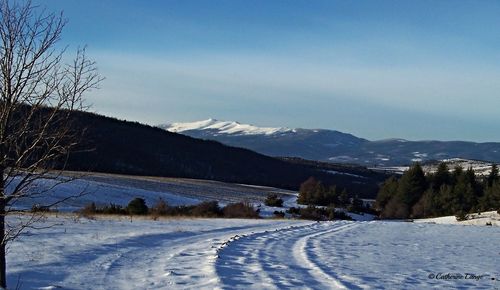 Scenic view of mountains against sky during winter