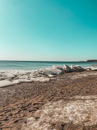 Scenic view of sea against clear blue sky