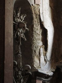 Statue of buddha against wall