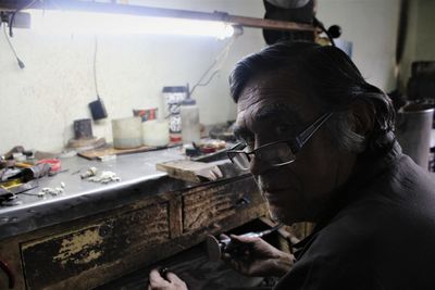 Portrait of manual worker working in factory