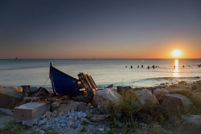 Scenic view of sea against clear sky during sunset