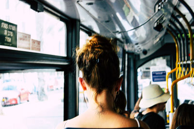 Rear view of woman in train