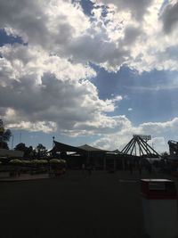 Road by building against sky