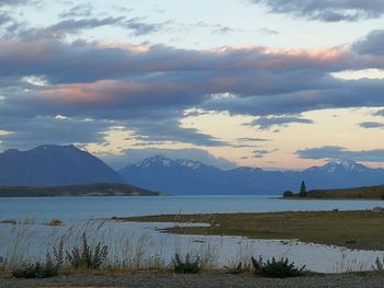 Scenic view of lake against sky during sunset
