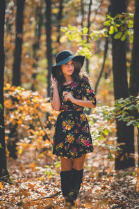 Woman standing in forest