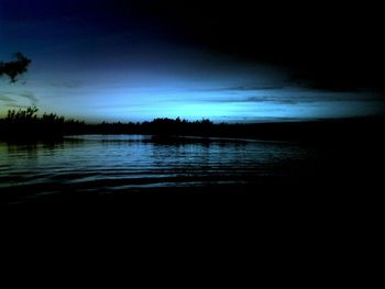 Scenic view of calm lake at sunset