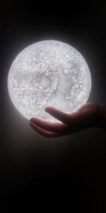 Close-up of hand holding moon