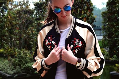 Portrait of young woman wearing sunglasses