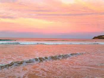 Scenic view of sea at sunset