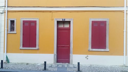 Yellow door of building