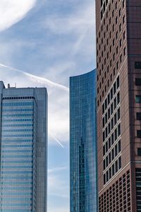 Low angle view of modern buildings against sky in city