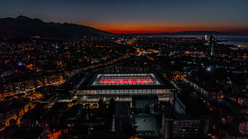 High angle view of illuminated buildings in city at night