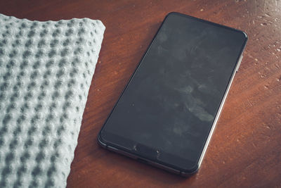 High angle view of mobile phone on table