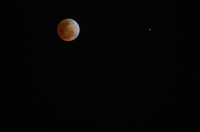 Scenic view of moon against sky at night