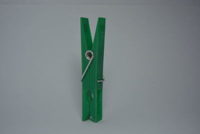 High angle view of green colored pencils on white background