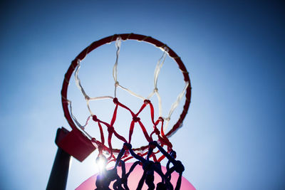 Low angle view of basketball hoop against clear sky