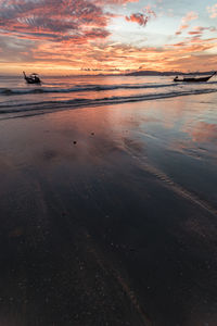 Scenic view of sea against sky at sunset