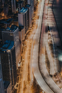 High angle view of light trails on road at night