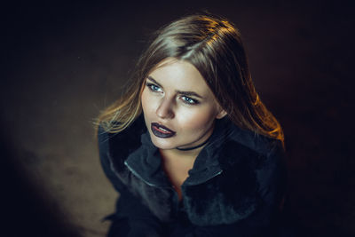 High angle view of young woman with black lipstick