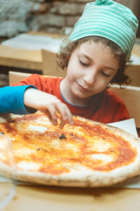 Portrait of boy with ice cream in plate