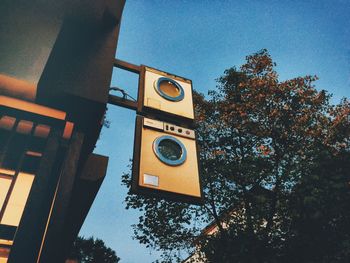 Low angle view of road sign against sky