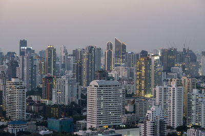 Aerial view of modern buildings in city against sky