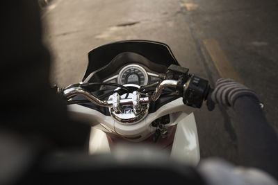 Cropped image of person on scooter