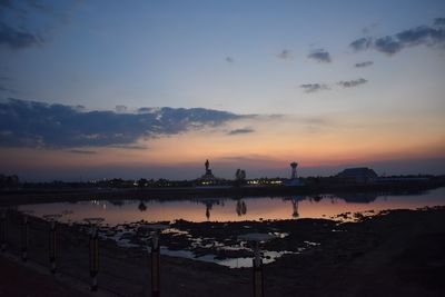 Scenic view of lake against sky during sunset