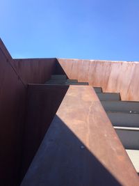 Low angle view of building against clear blue sky