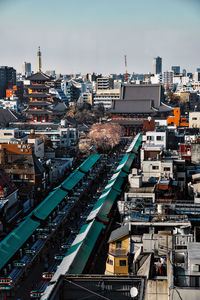 High angle view of city buildings against sky