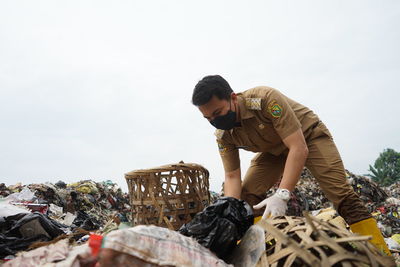 Man working at garbage dump