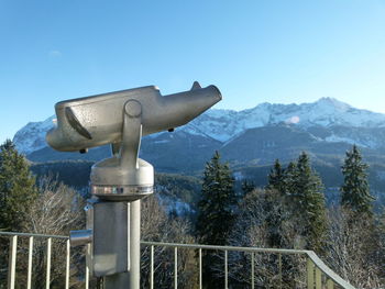 Statue on mountain against clear blue sky