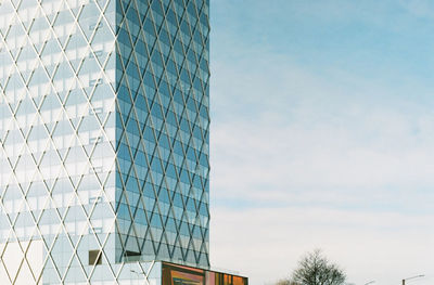 Low angle view of modern building against sky