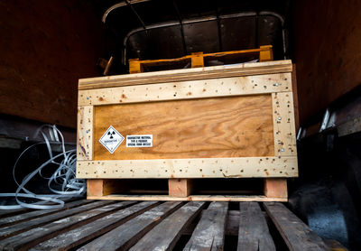 Radioactive material label beside the transportation wooden box type a standard package in the truck