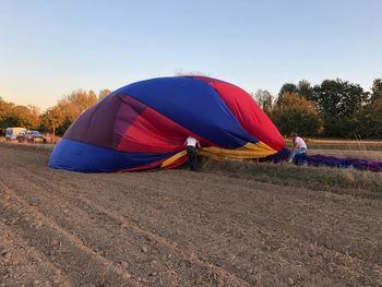 Tent on field against clear sky