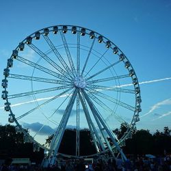 Low angle view of ferris wheel against sky