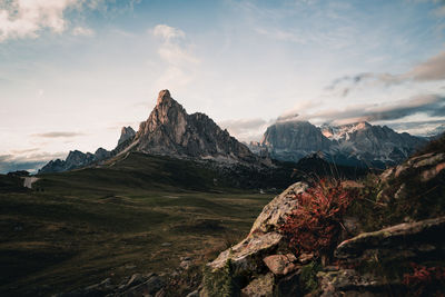 Scenic view of mountains against cloudy sky